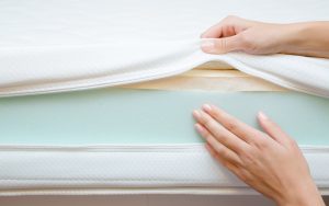 woman showing foam in mattress